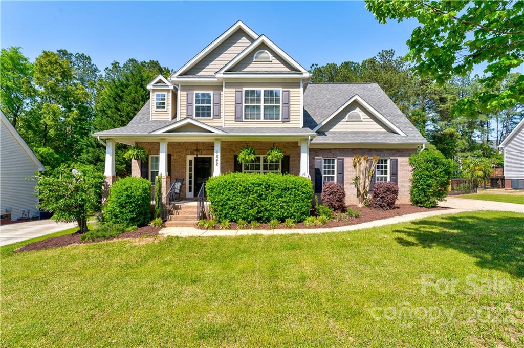 1842 Sam Smith Road Fort Mill, SC 29708 - Photo 1 of 28 a front view of a house with a yard