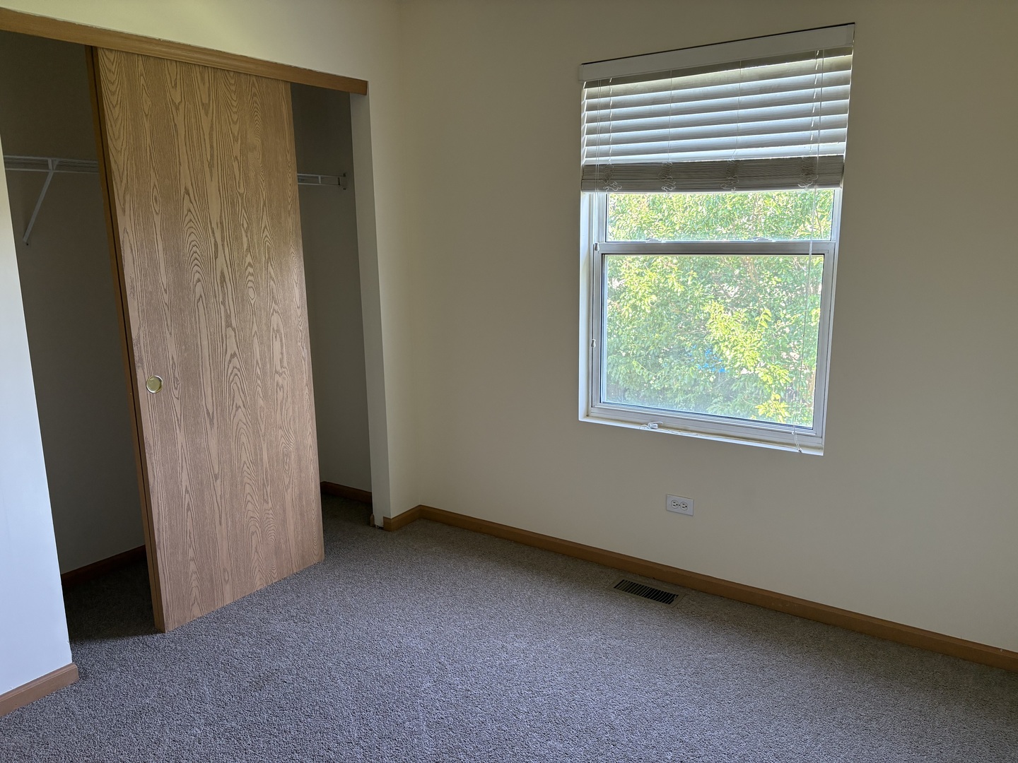7207 Bradley Drive Plainfield, IL 60586 - Photo 7 of 12 an empty room with a window