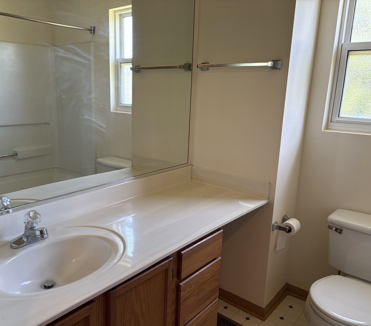 7207 Bradley Drive Plainfield, IL 60586 - Photo 8 of 12 a bathroom with a sink and a toilet