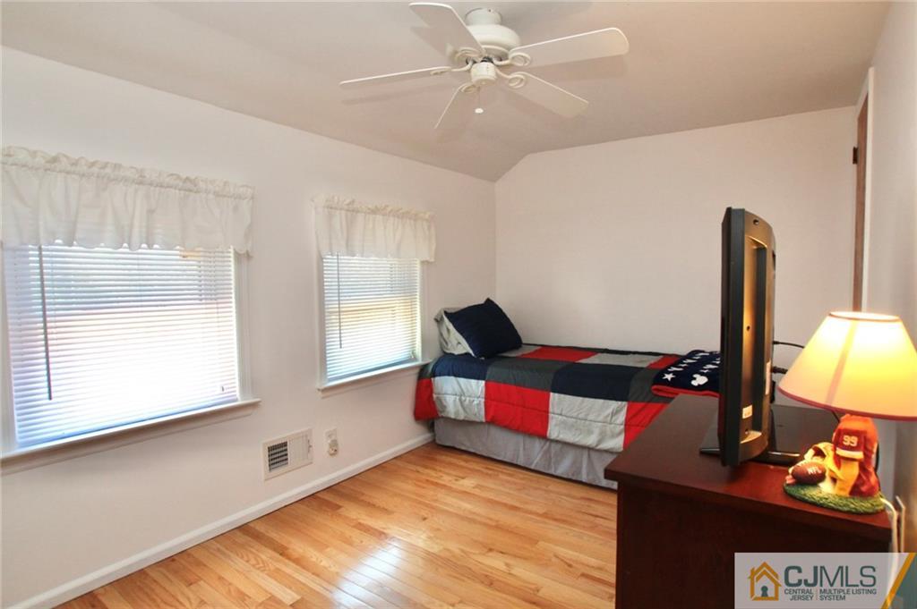 386 East Pleasant Grove Road Jackson, NJ 08527 - Photo 20 of 24 a bedroom with furniture and a window