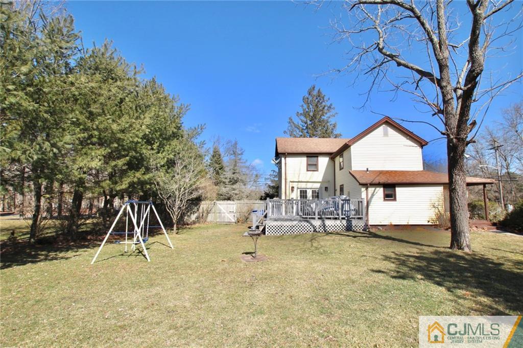 386 East Pleasant Grove Road Jackson, NJ 08527 - Photo 3 of 24 a view of house with backyard and a tree
