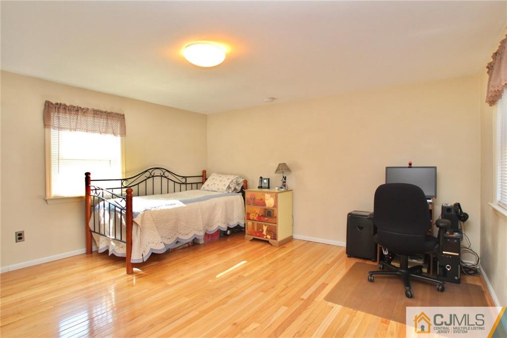 386 East Pleasant Grove Road Jackson, NJ 08527 - Photo 21 of 24 a bedroom with furniture and a window