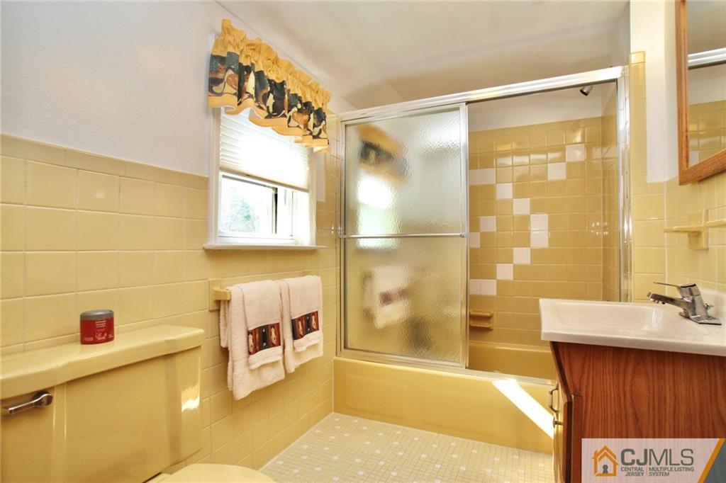 386 East Pleasant Grove Road Jackson, NJ 08527 - Photo 24 of 24 a bathroom with a bathtub and a shower
