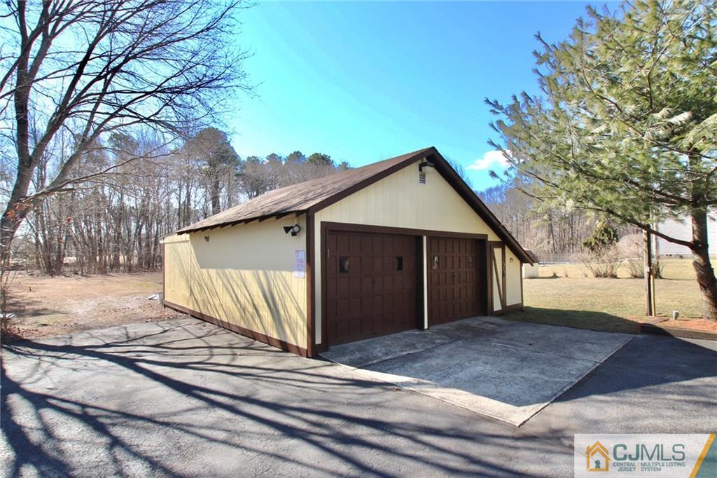 386 East Pleasant Grove Road Jackson, NJ 08527 - Photo 4 of 24 a view of a house with a yard