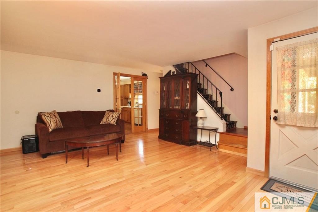 386 East Pleasant Grove Road Jackson, NJ 08527 - Photo 9 of 24 a living room with furniture and a wooden floor