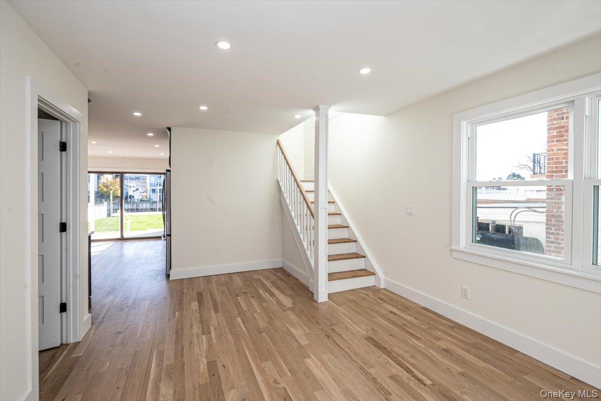 55 Alhambra Road Massapequa, NY 11758 - Photo 17 of 38 a view of entryway with wooden floor