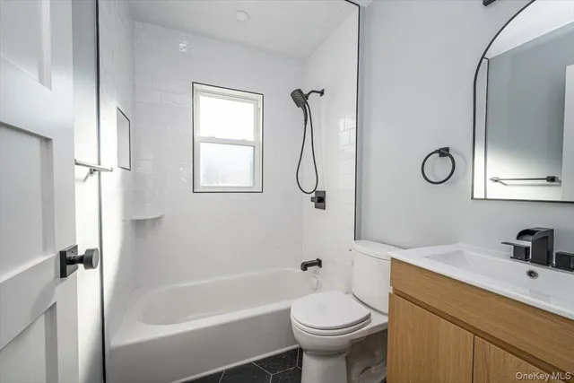 a view of a hallway with a washer and dryer