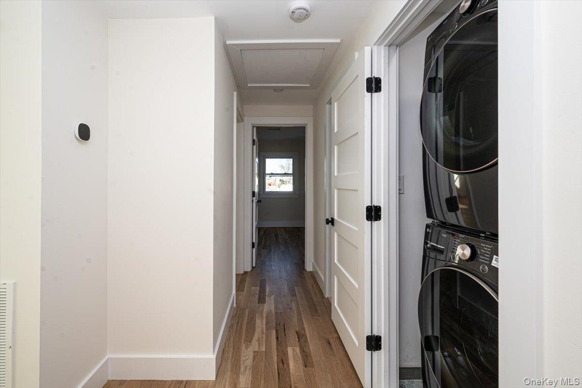 55 Alhambra Road Massapequa, NY 11758 - Photo 22 of 38 a view of a hallway with a washer and dryer