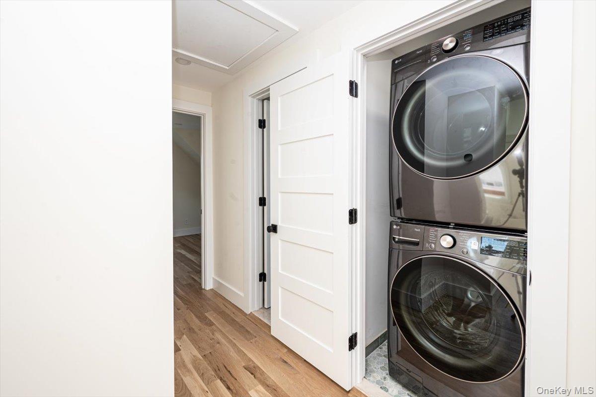 55 Alhambra Road Massapequa, NY 11758 - Photo 23 of 38 a utility room with dryer and washer