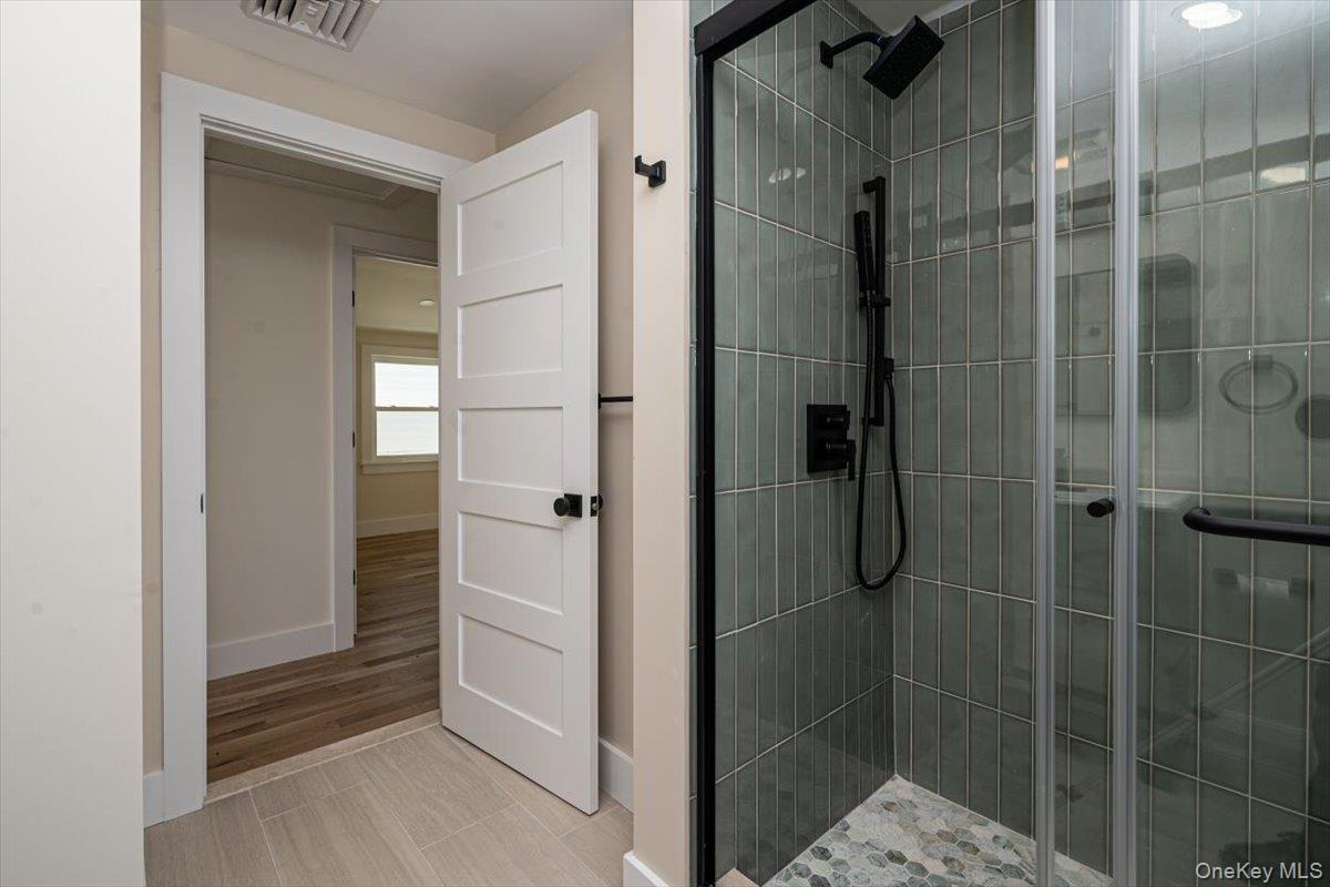 55 Alhambra Road Massapequa, NY 11758 - Photo 28 of 38 a bathroom with a shower