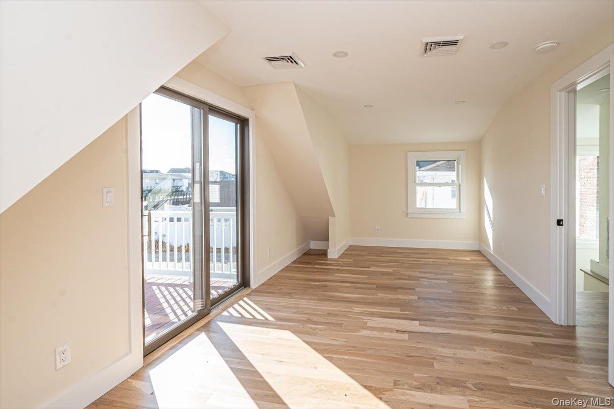 55 Alhambra Road Massapequa, NY 11758 - Photo 32 of 38 a view of an empty room and window