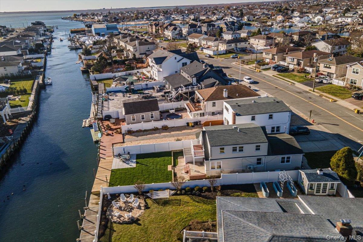 55 Alhambra Road Massapequa, NY 11758 - Photo 6 of 38 an aerial view of a house with swimming pool