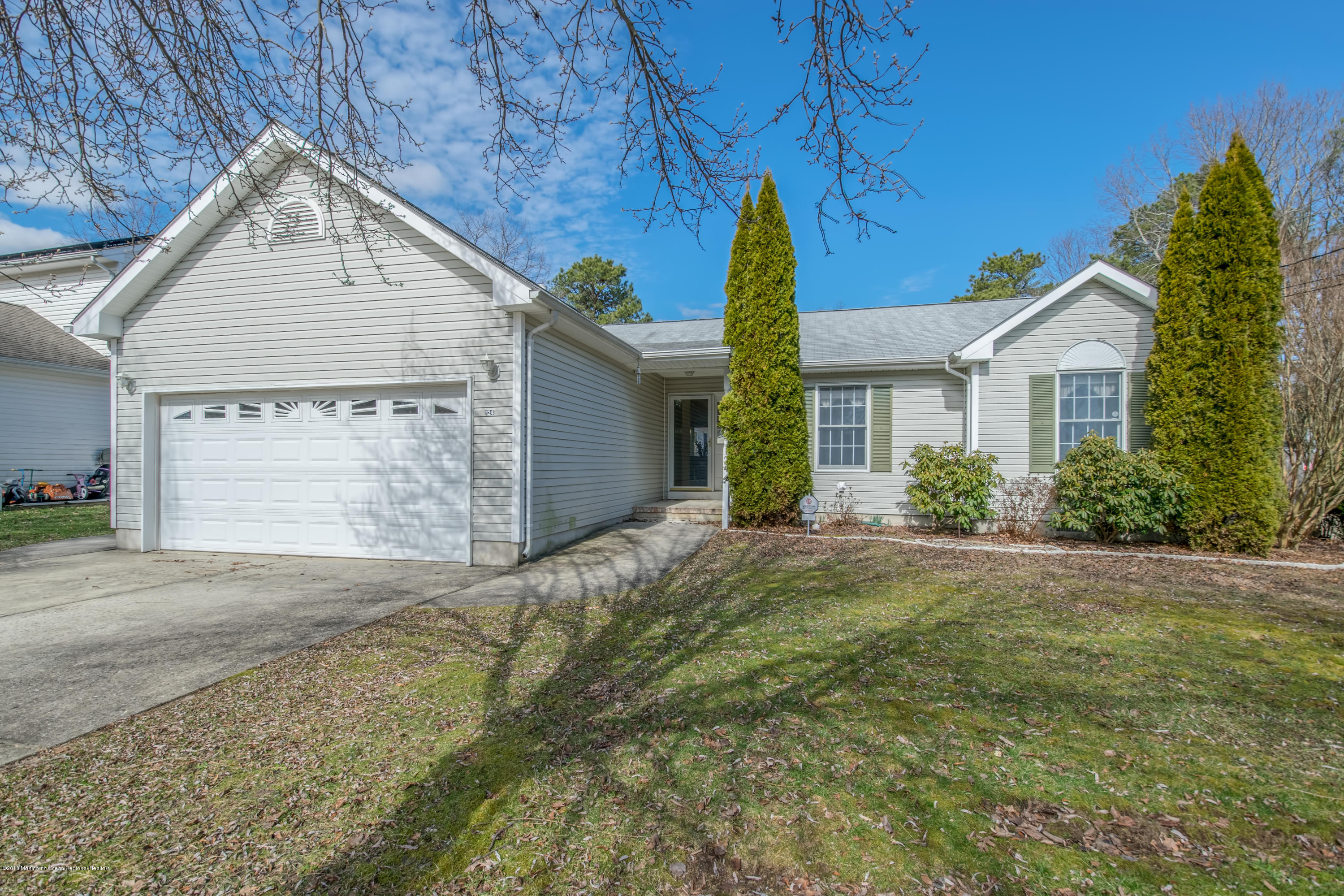 124 Marlin Road Manahawkin, NJ 08050 - Photo 1 of 34 a view of backyard with large garden