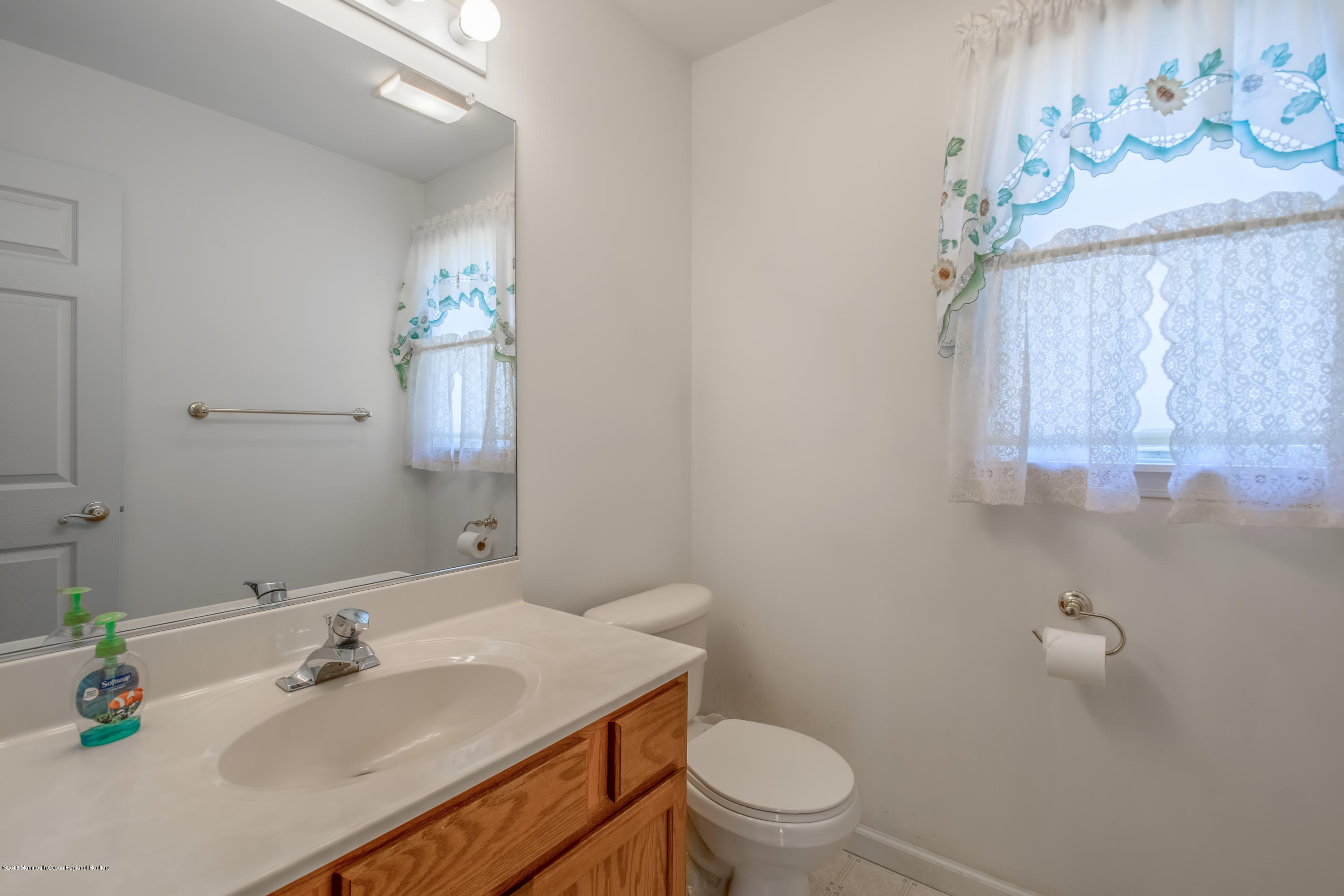 124 Marlin Road Manahawkin, NJ 08050 - Photo 11 of 34 a bathroom with a sink vanity granite and toilet