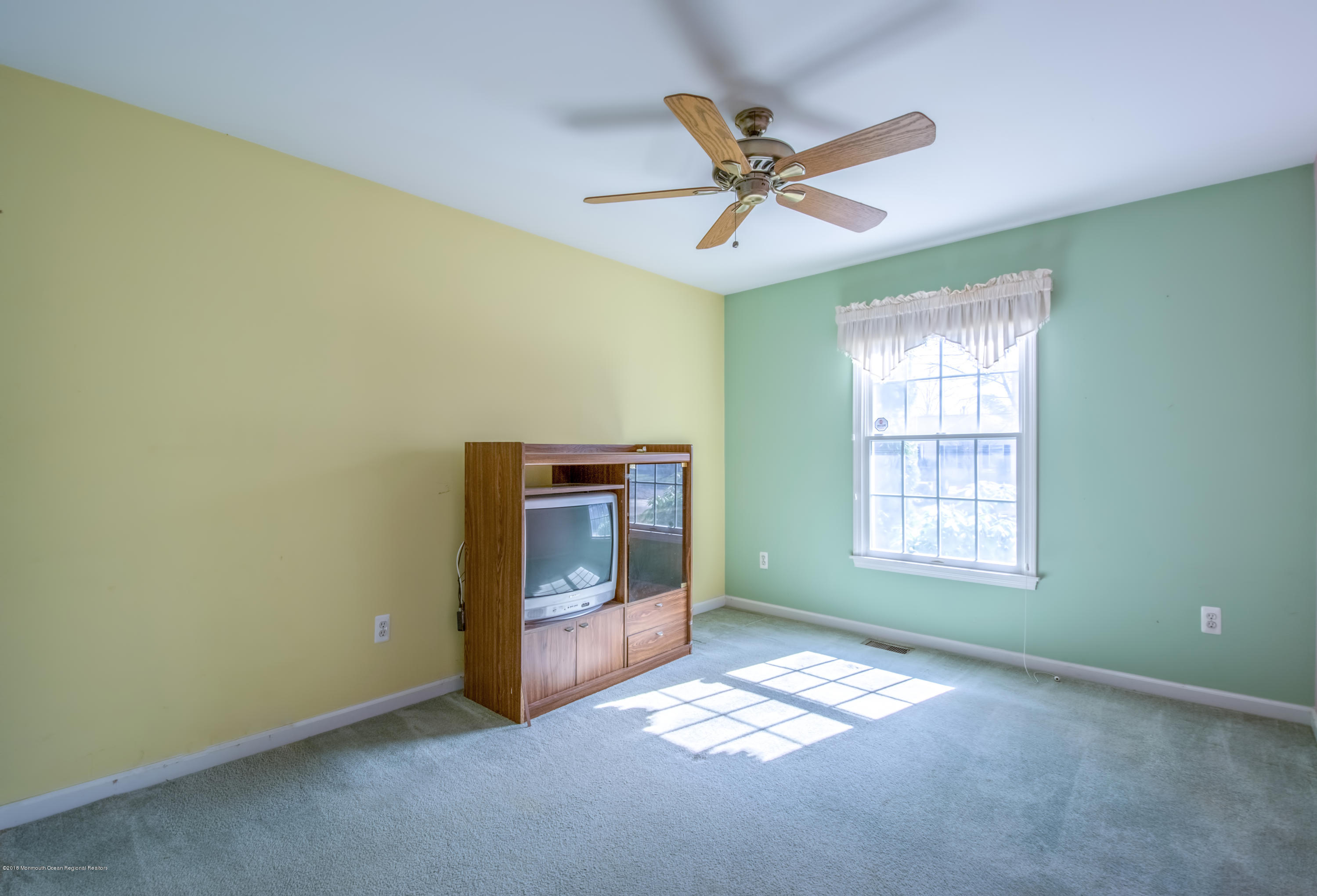 124 Marlin Road Manahawkin, NJ 08050 - Photo 13 of 34 a view of an empty room with a window