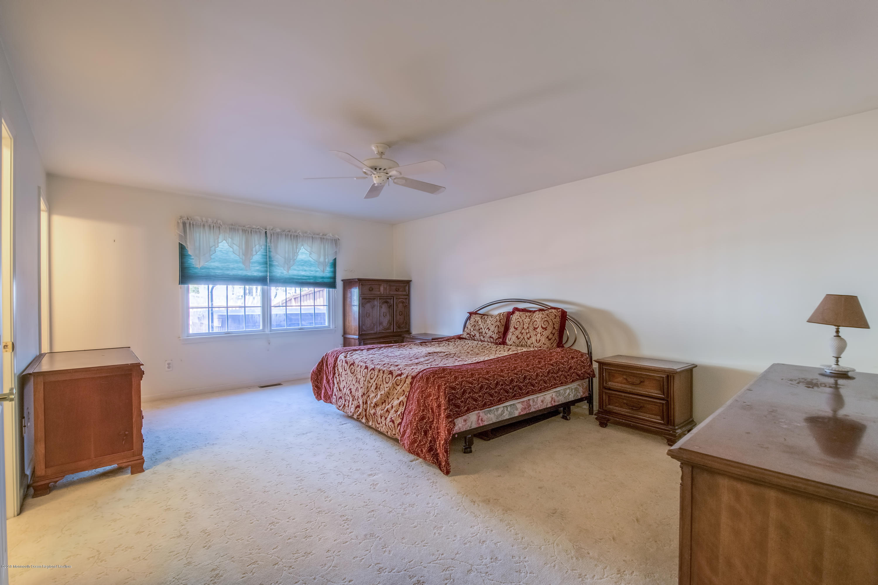 124 Marlin Road Manahawkin, NJ 08050 - Photo 15 of 34 a spacious bedroom with two beds and a window