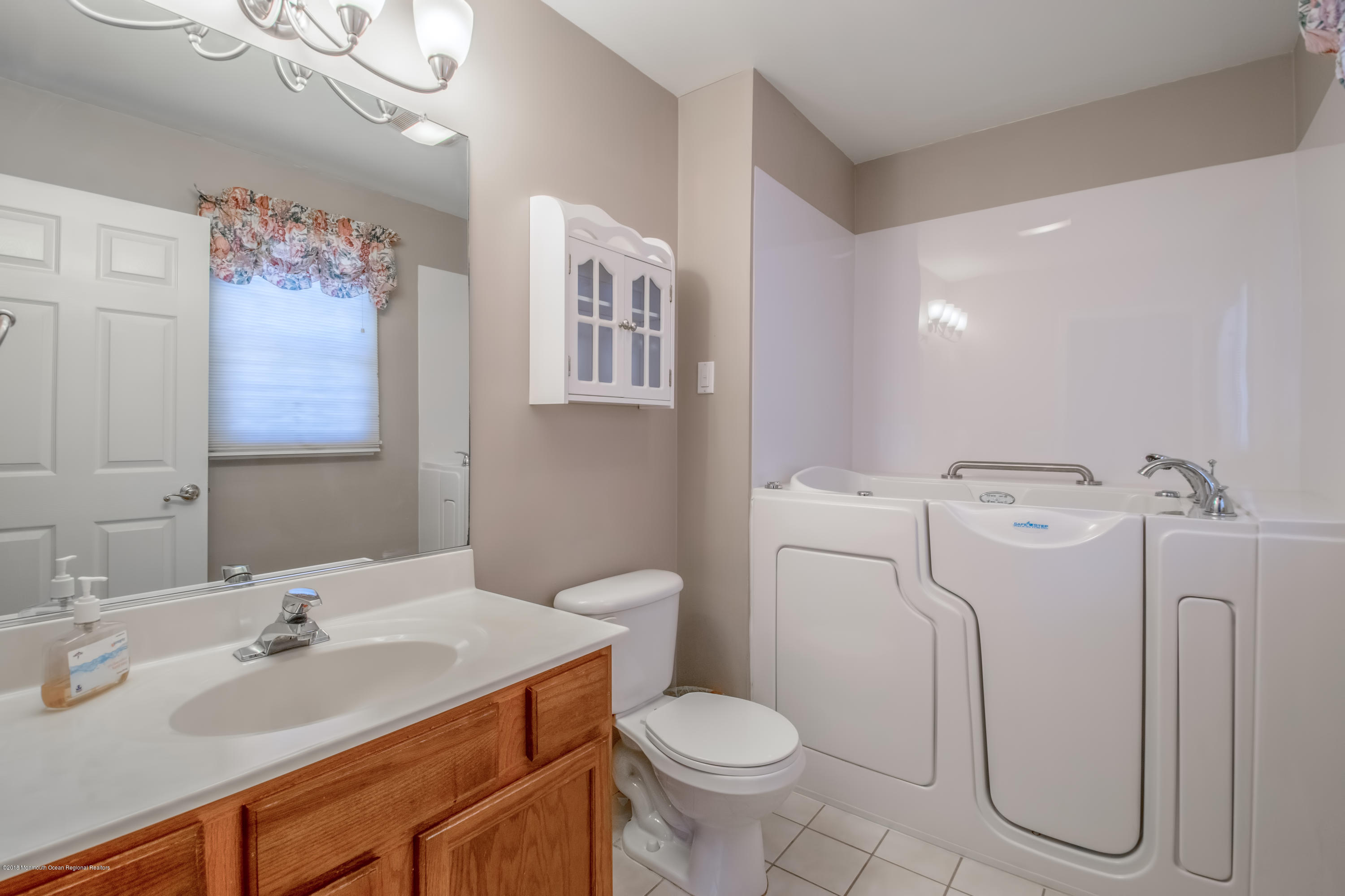 124 Marlin Road Manahawkin, NJ 08050 - Photo 18 of 34 a bathroom with a sink toilet and shower