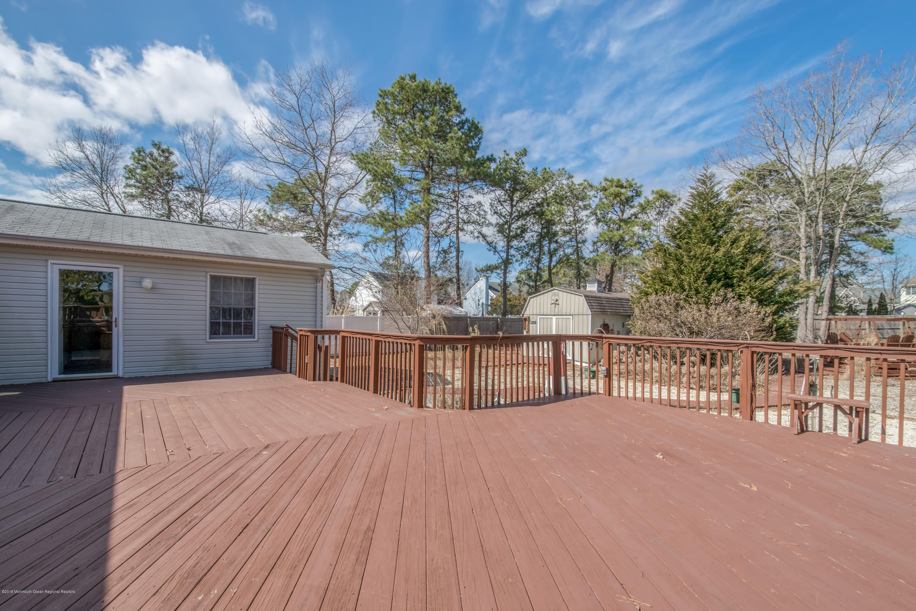 124 Marlin Road Manahawkin, NJ 08050 - Photo 22 of 34 a view of balcony with wooden floor and fence