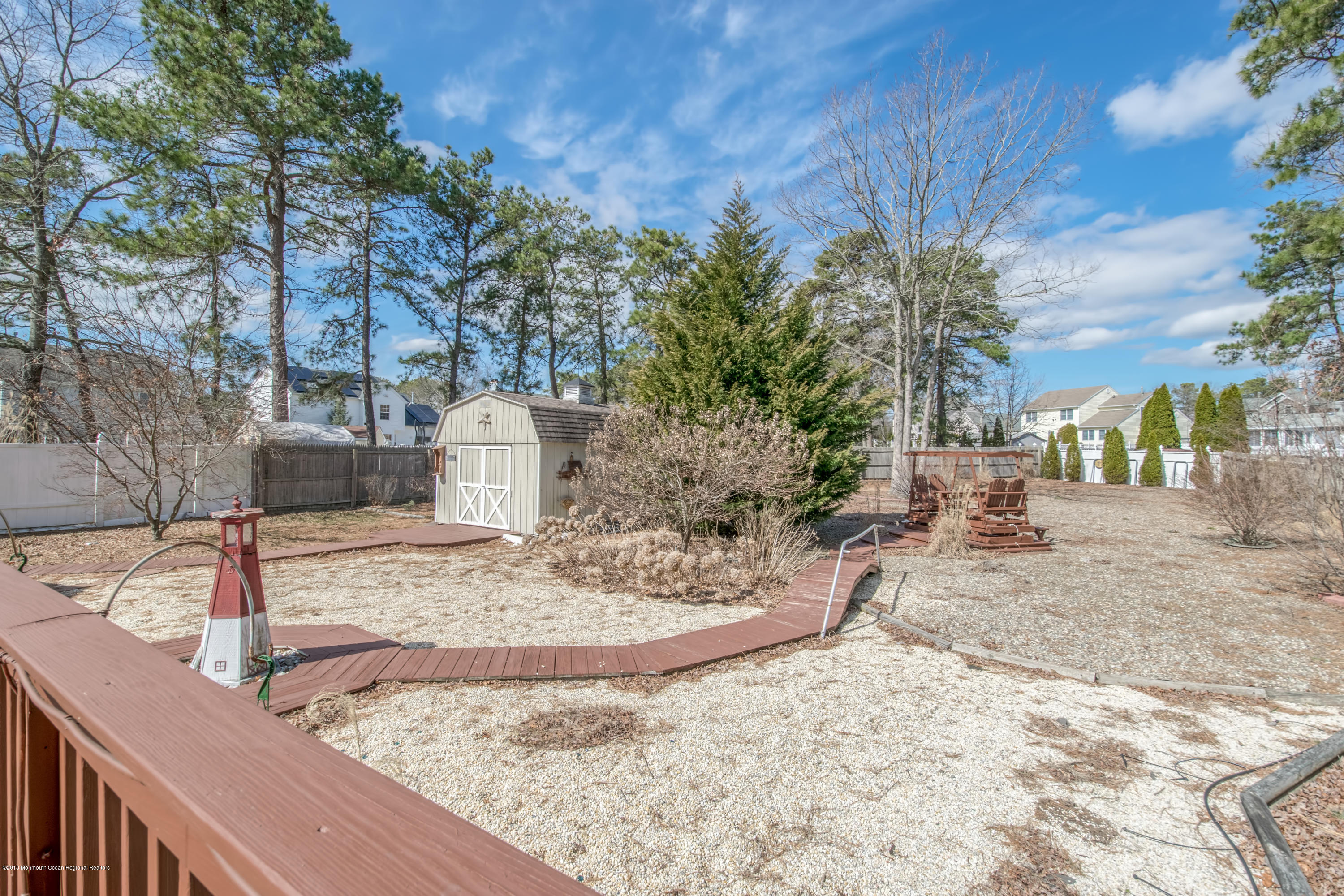 124 Marlin Road Manahawkin, NJ 08050 - Photo 23 of 34 a view of a backyard that has a tree