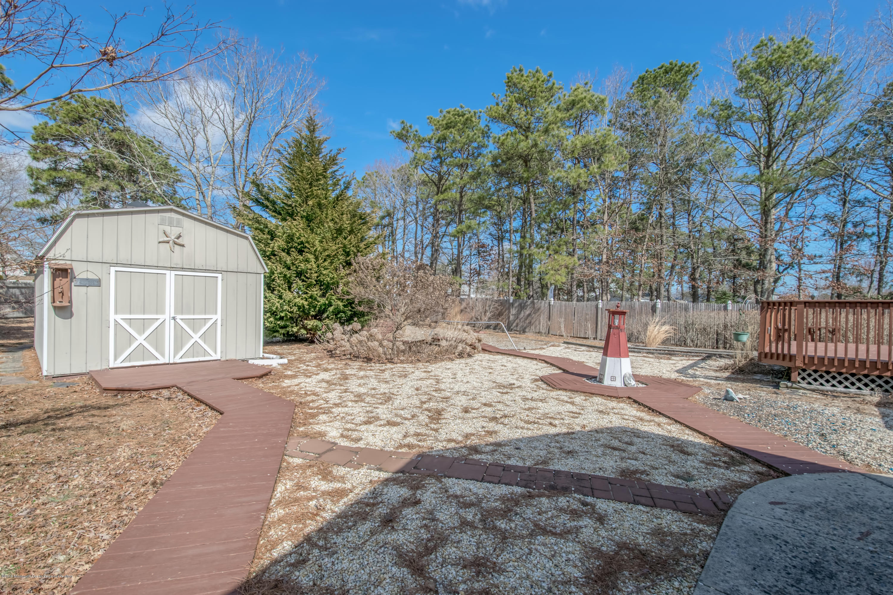 124 Marlin Road Manahawkin, NJ 08050 - Photo 24 of 34 a backyard of a house with lots of green space