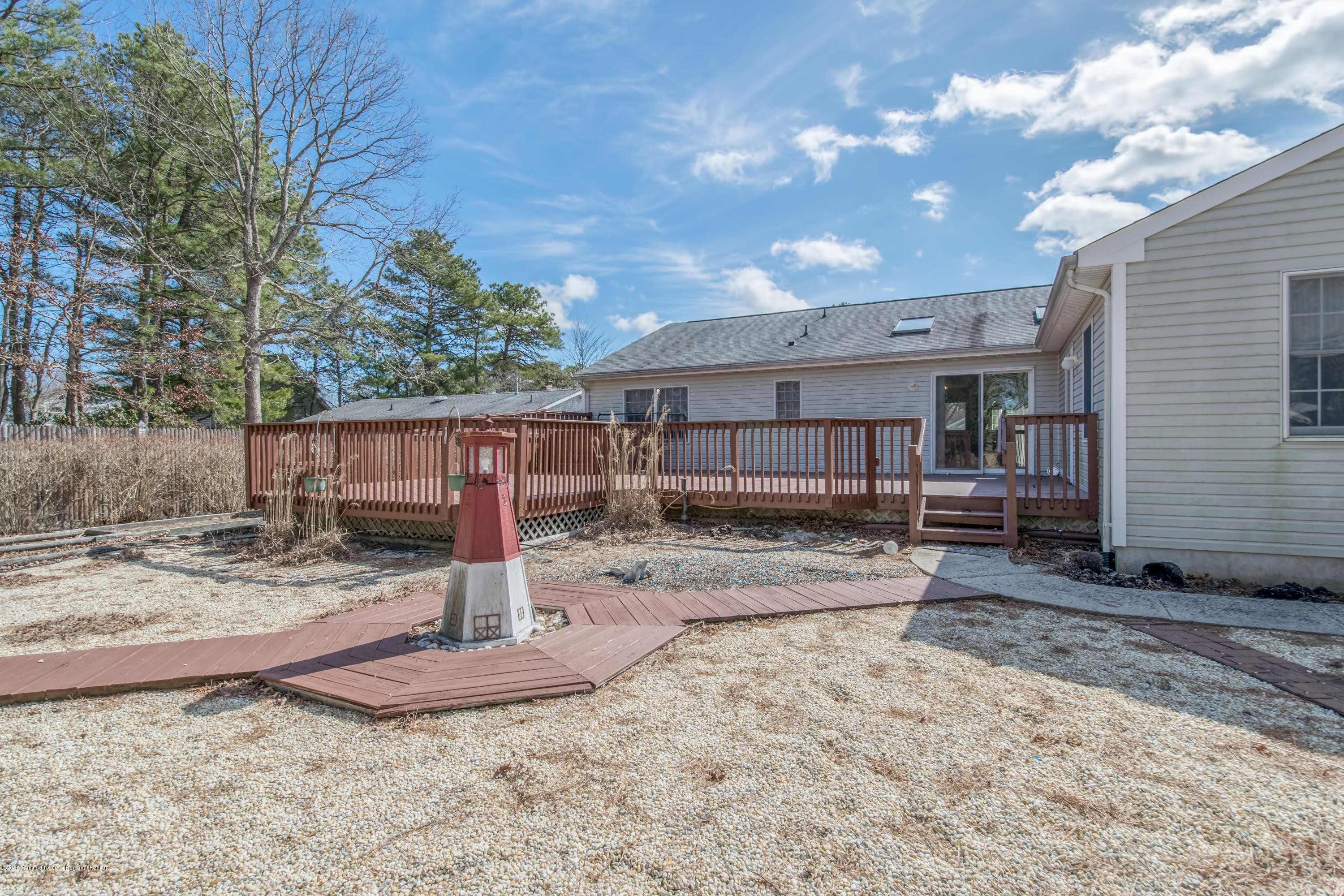 124 Marlin Road Manahawkin, NJ 08050 - Photo 25 of 34 a view of a backyard with a large tree