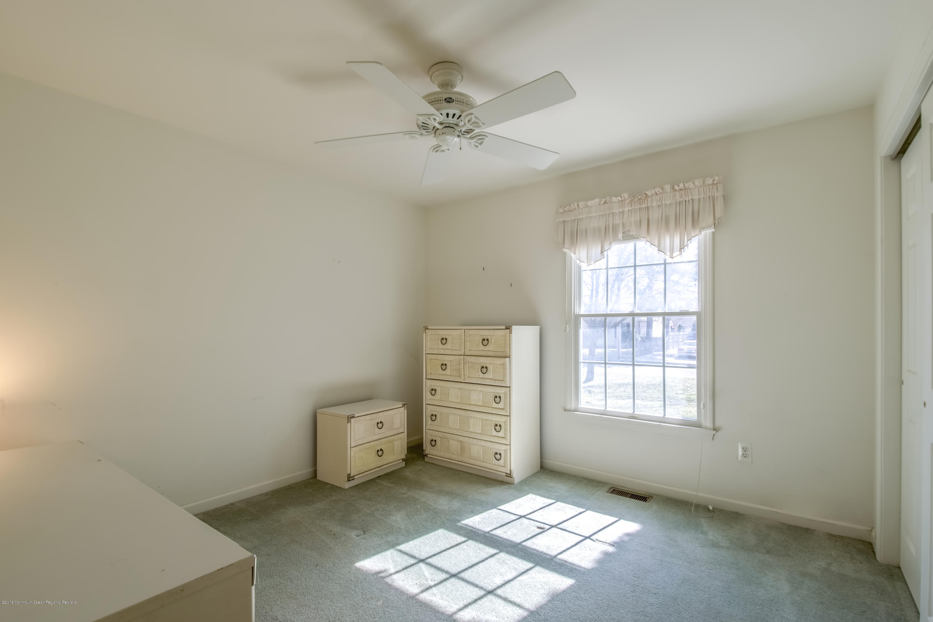 124 Marlin Road Manahawkin, NJ 08050 - Photo 10 of 34 a view of an empty room with a window