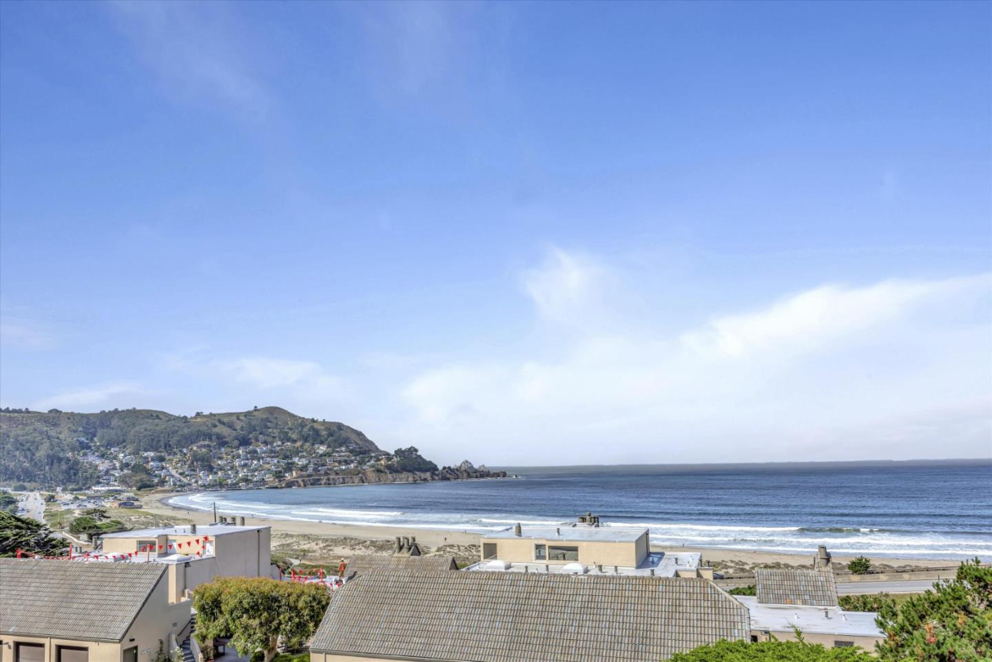 a view of city with ocean