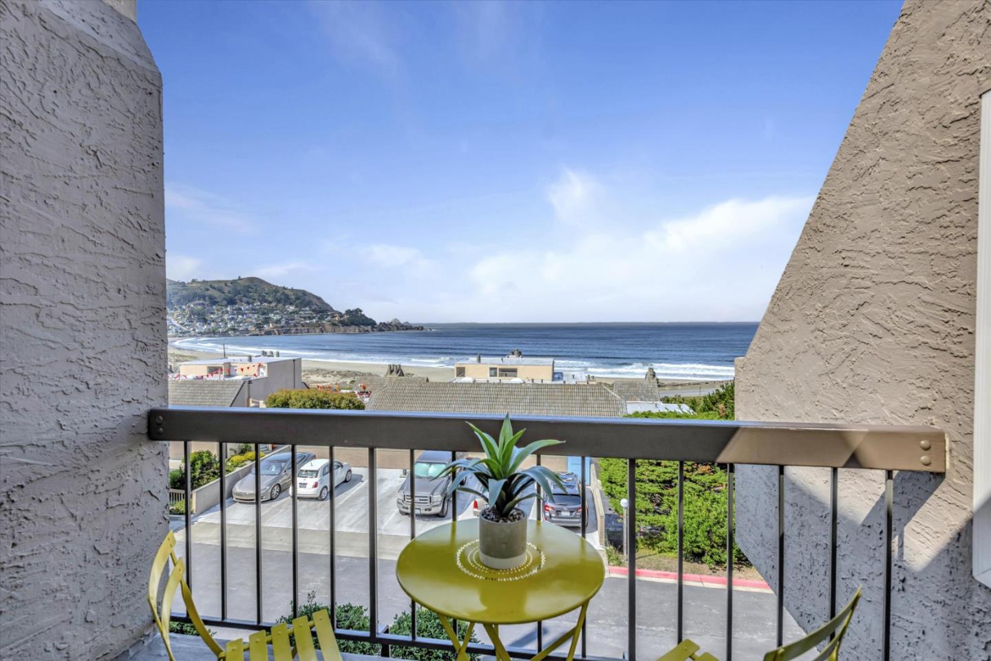 459 Roberts Road Pacifica, CA 94044 - Photo 15 of 50 a view of a balcony with chair and a potted plant