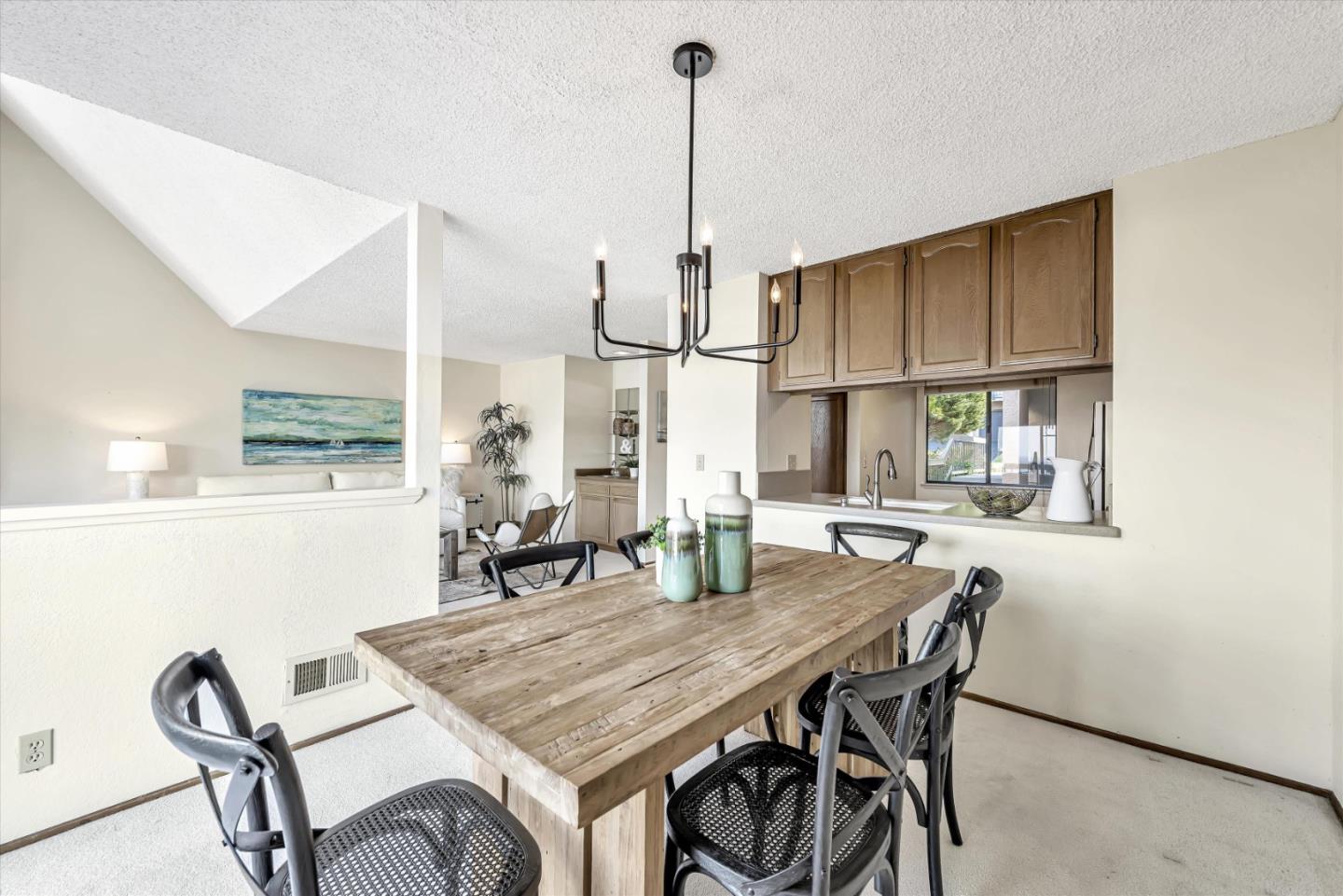 459 Roberts Road Pacifica, CA 94044 - Photo 16 of 50 a dining room with furniture and window