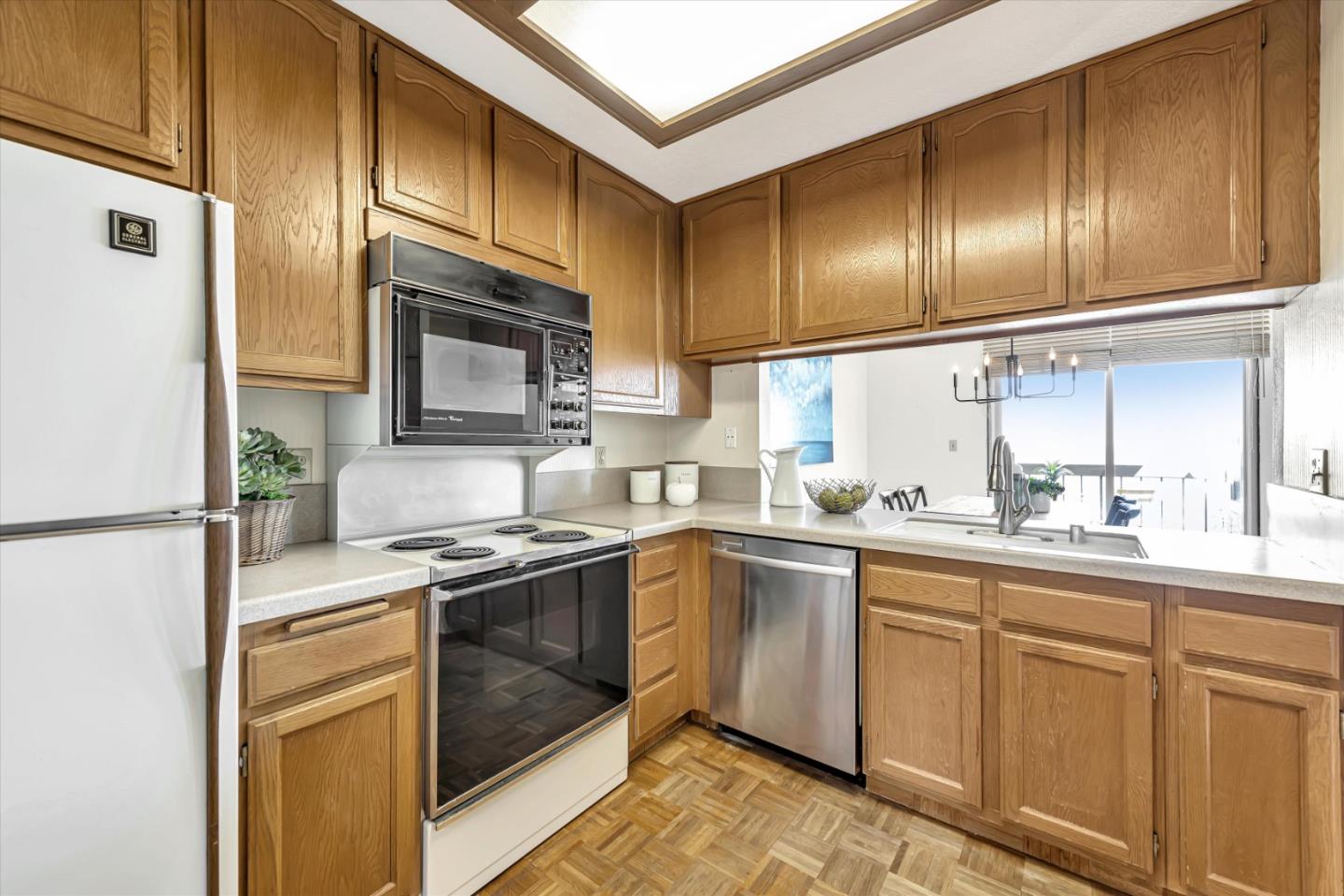 459 Roberts Road Pacifica, CA 94044 - Photo 19 of 50 a kitchen with cabinets stainless steel appliances and a sink