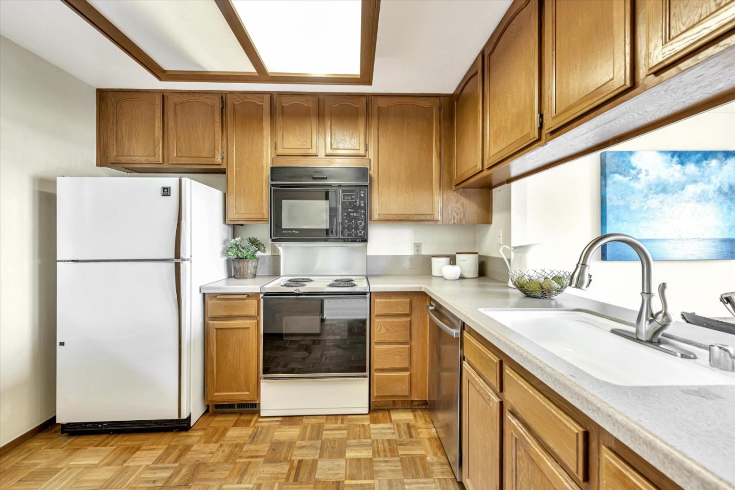 459 Roberts Road Pacifica, CA 94044 - Photo 20 of 50 a kitchen with a sink a refrigerator and cabinets