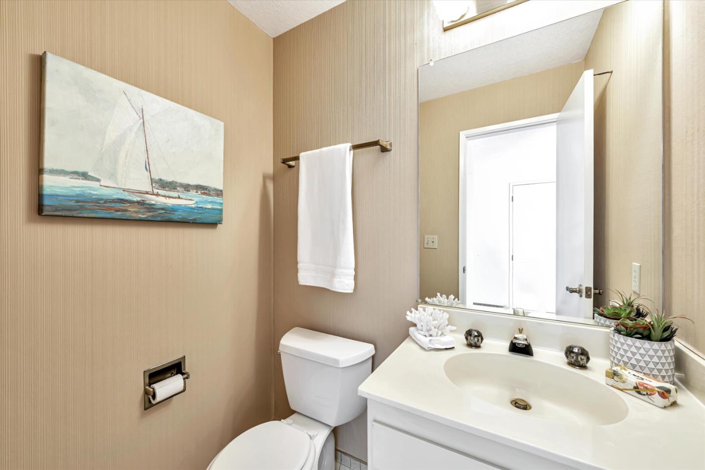 459 Roberts Road Pacifica, CA 94044 - Photo 21 of 50 a bathroom with a toilet a sink and a large mirror