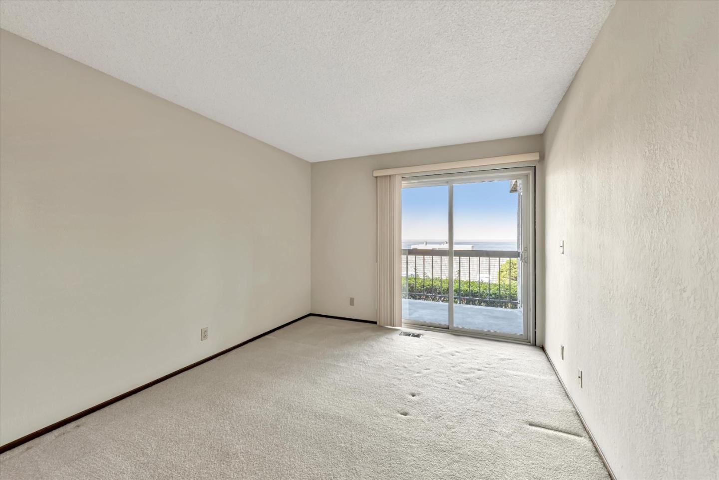 459 Roberts Road Pacifica, CA 94044 - Photo 29 of 50 an empty room with sliding door