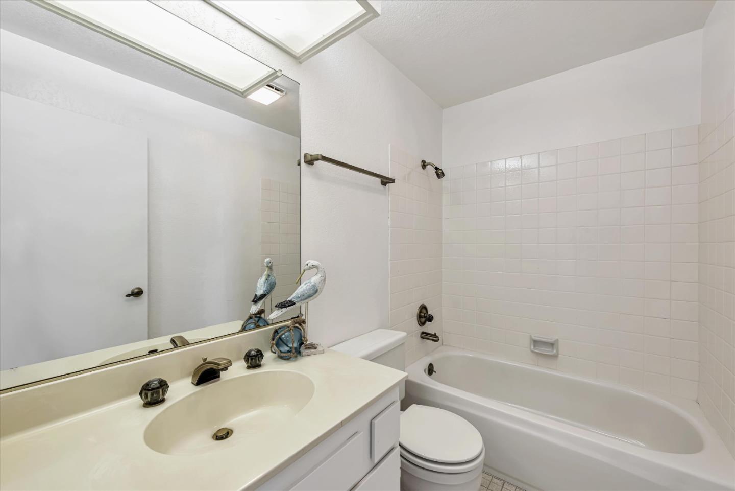 459 Roberts Road Pacifica, CA 94044 - Photo 33 of 50 a bathroom with a bathtub shower sink vanity mirror and toilet