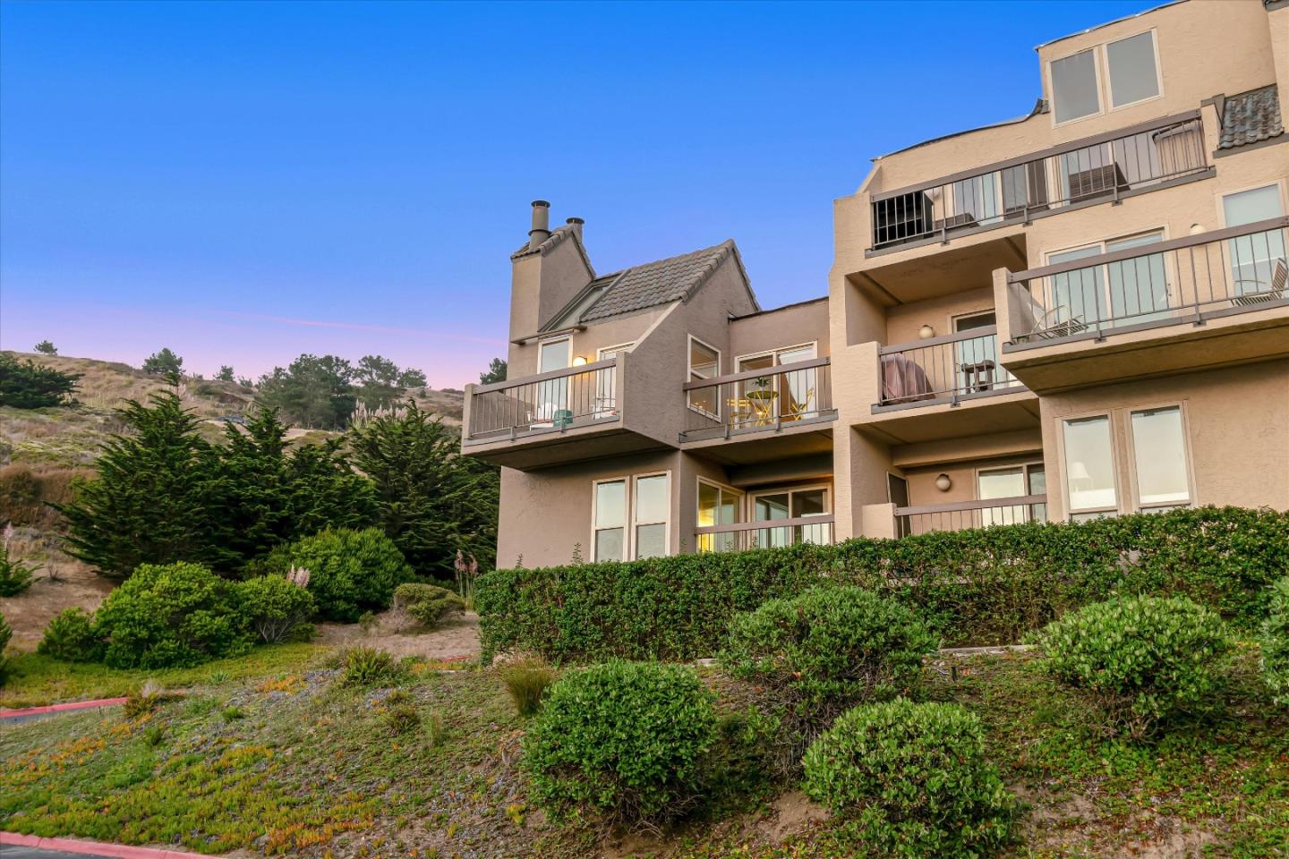 459 Roberts Road Pacifica, CA 94044 - Photo 39 of 50 a front view of a building with a garden and plants