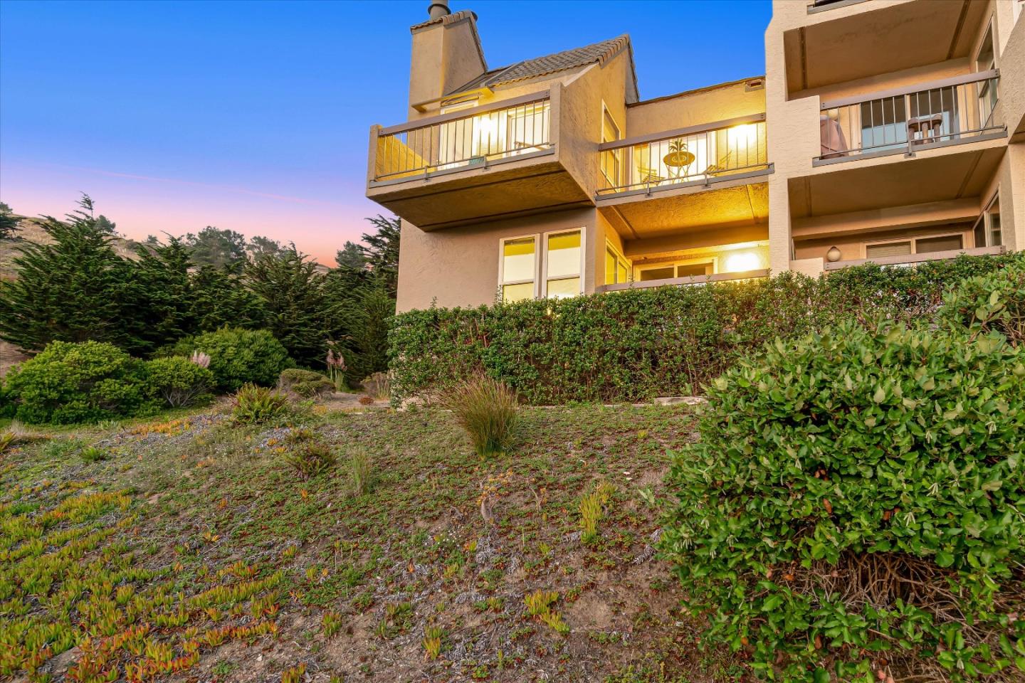 459 Roberts Road Pacifica, CA 94044 - Photo 4 of 50 a yellow building with trees in front of it