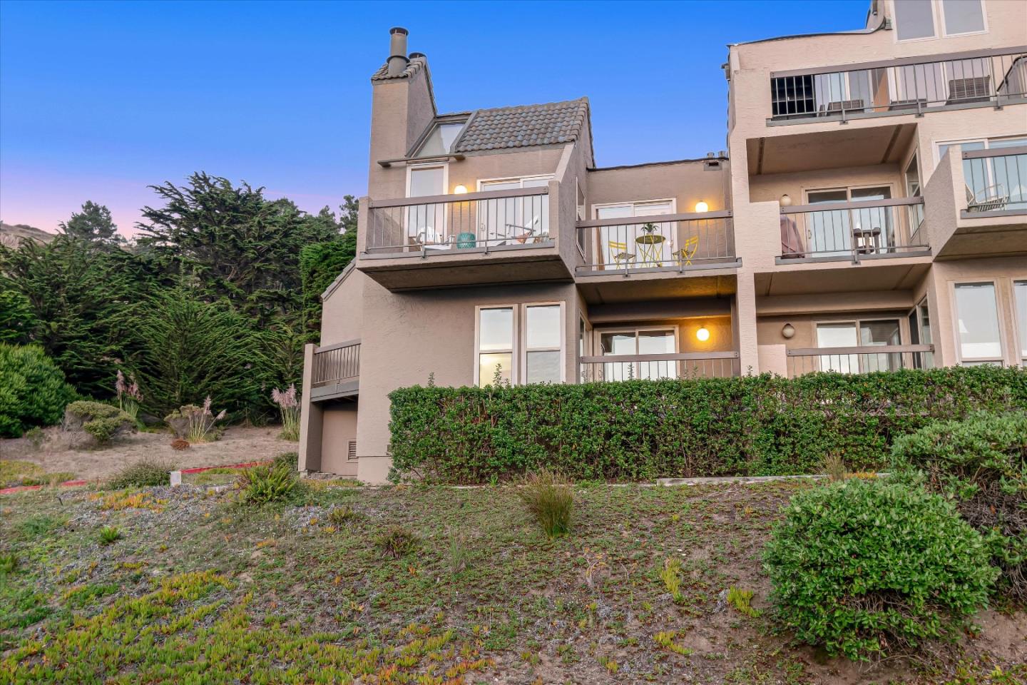 459 Roberts Road Pacifica, CA 94044 - Photo 49 of 50 a front view of a residential apartment building with a yard