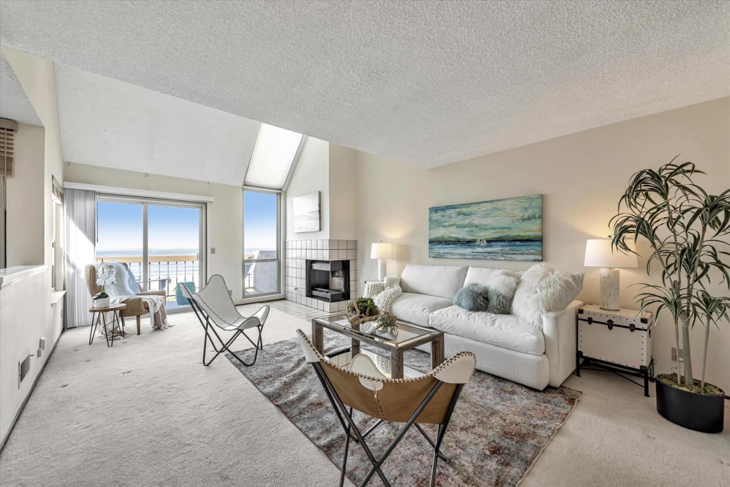 459 Roberts Road Pacifica, CA 94044 - Photo 9 of 50 a living room with furniture potted plant and a fireplace