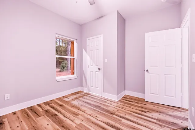a view of room with window and ceiling fan
