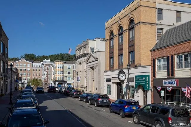 a view of a street with cars