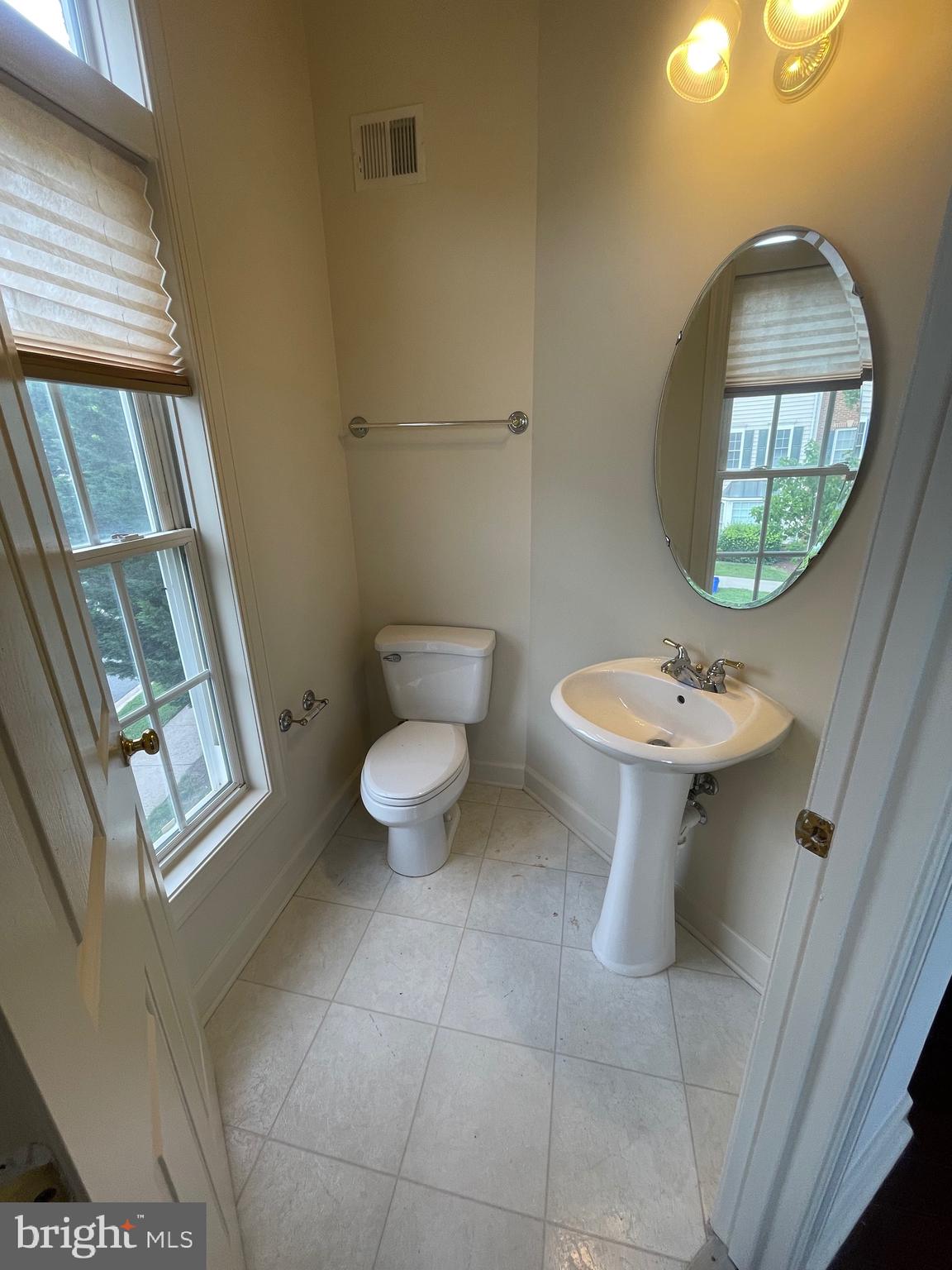 23402 Winemiller Way Clarksburg, MD 20871 - Photo 9 of 22 a bathroom with a sink toilet and a mirror