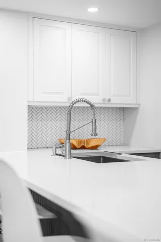 a living room with furniture a fireplace and a large window
