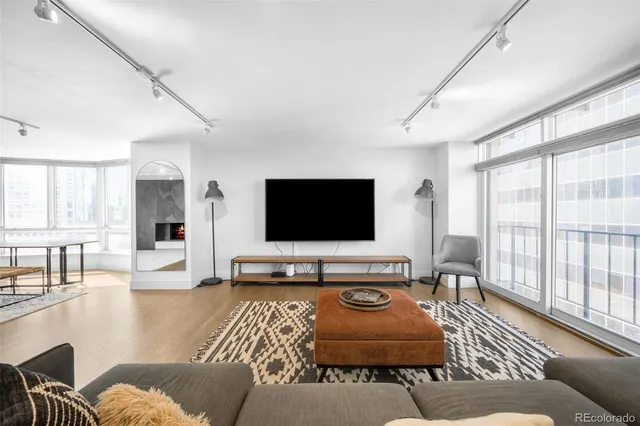 a kitchen with stainless steel appliances a sink dishwasher a stove and a refrigerator