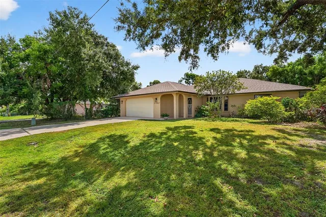 a blue house with pool in front of it