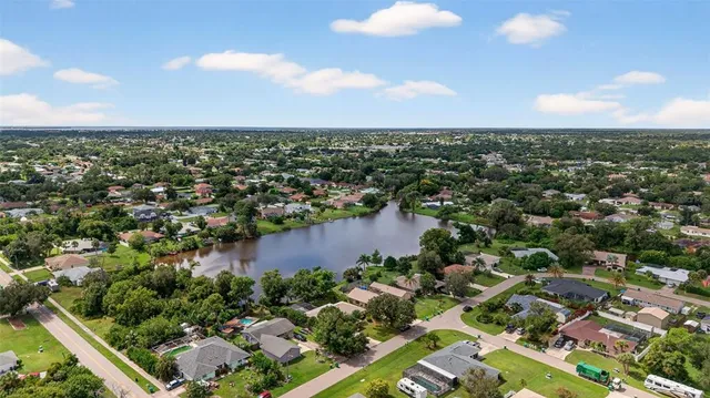 an aerial view of city and lake