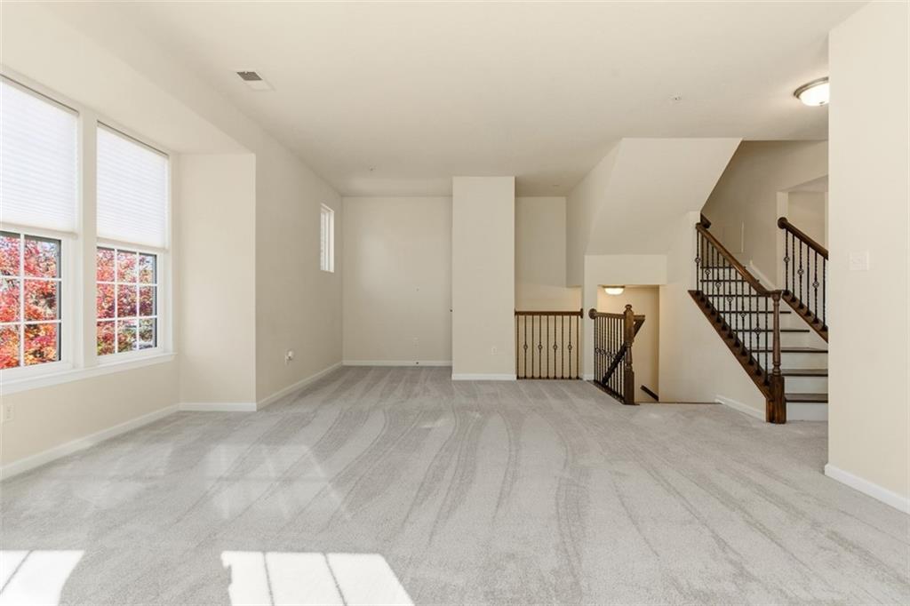 3001 Pointe View Drive Mars, PA 16046 - Photo 12 of 48 a view of a livingroom with wooden floor and stairs