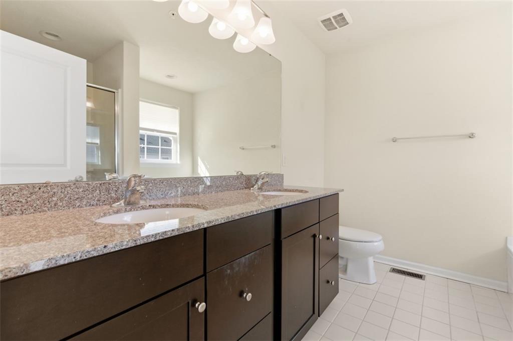 3001 Pointe View Drive Mars, PA 16046 - Photo 25 of 48 a bathroom with a granite countertop sink a toilet and a mirror