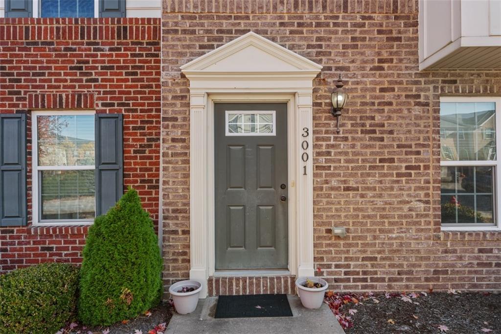 3001 Pointe View Drive Mars, PA 16046 - Photo 4 of 48 a view of a brick house with a door and a window
