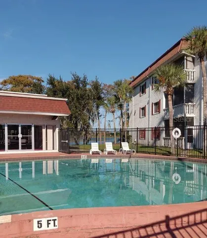 a view of a building with a yard