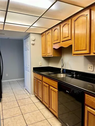 a kitchen with stainless steel appliances granite countertop a sink and cabinets